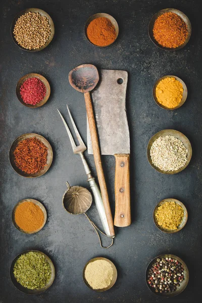 Various bowls of spices over dark background — Stock Photo, Image