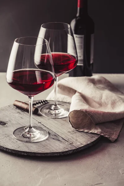 Glasses of red wine on concrete background — Stock Photo, Image