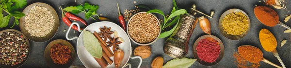 Herbs and spices on dark background, flat lay — Stock Photo, Image