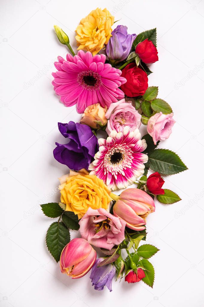 Creative layout made with beautiful flowers on white background. Flat lay. Spring minimal concept. Flat lay composition for entrepreneurs, bloggers, magazines, websites, social media and instagram