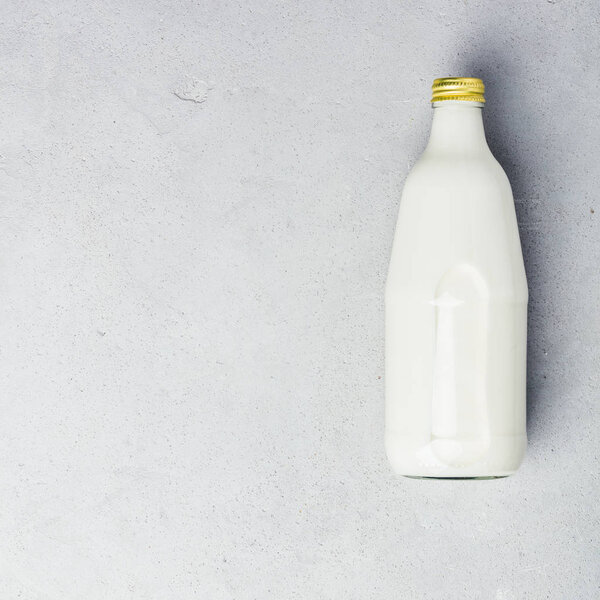  bottle of milk on grey concrete background