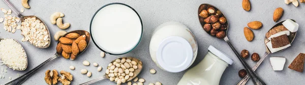 Latte vegano e ingredienti su sfondo rustico, posa piatta — Foto Stock