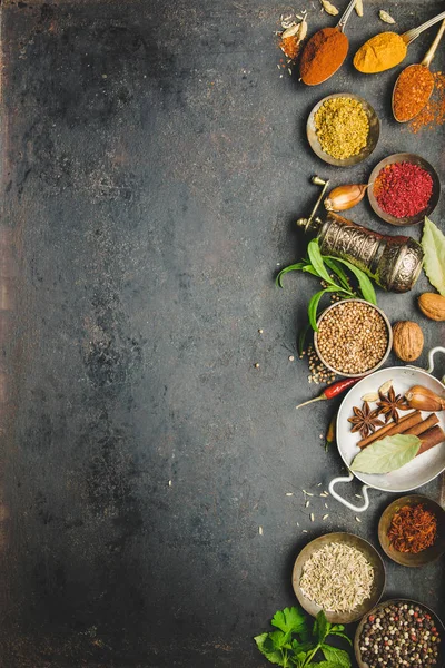 Herbs and spices on dark background — Stock Photo, Image