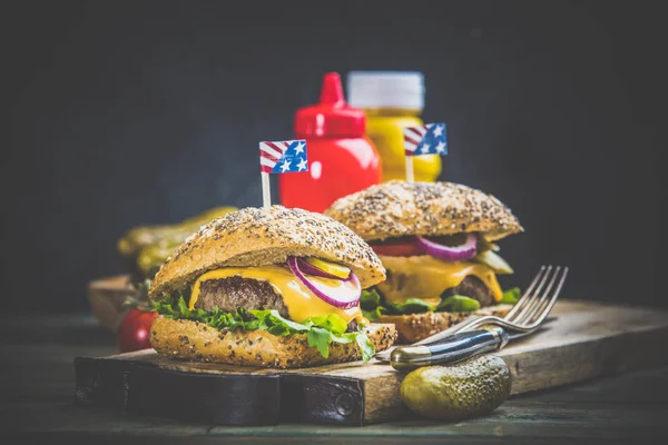 Homemade hamburgers on wooden background, space for text — Stock Photo, Image