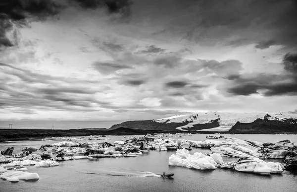 Glaciers on beaches of Iceland. Black-white photo.