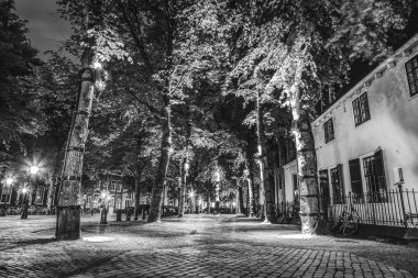 Streets and buildings of the ancient European city Utrecht. Black-white photo. clipart