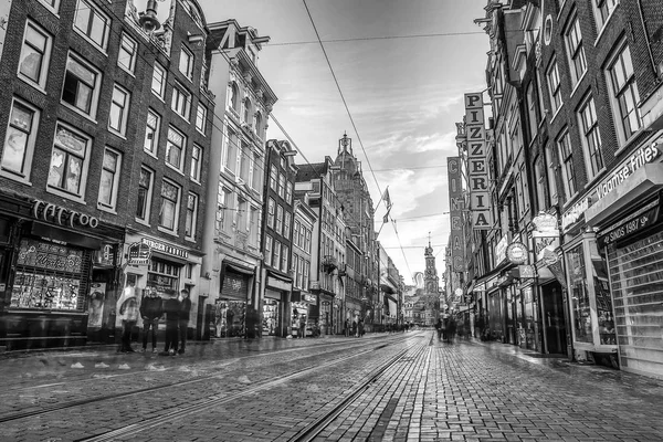 Traditional houses and streets in Amsterdam city. Black-white photo.
