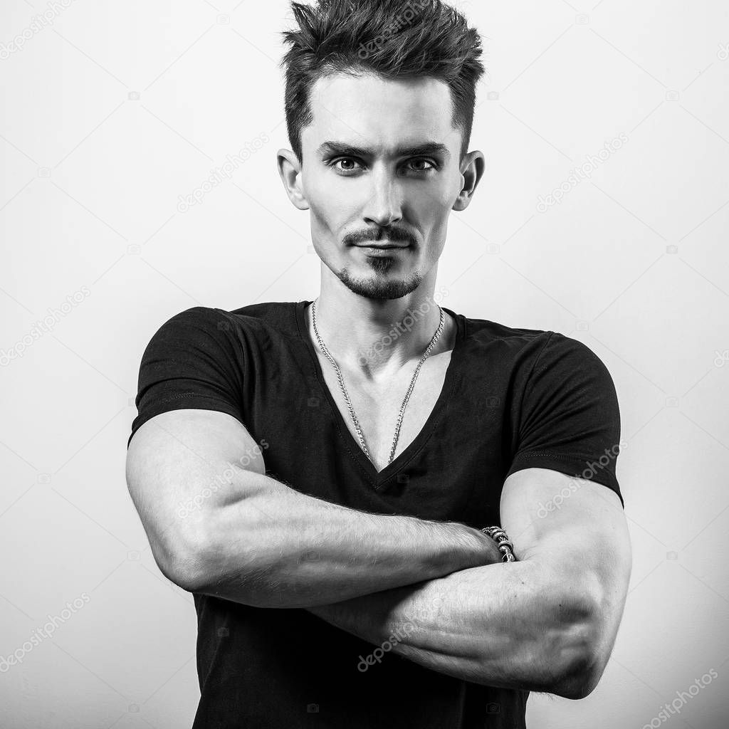 Young handsome man in t-shirt. Black-white photo.