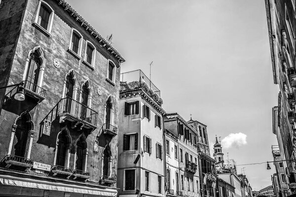 VENICE, ITALY - AUGUST 19, 2016: Famous architectural monuments and facades of old medieval buildings black-white photo. on August 19, 2016 in Venice, Italy.