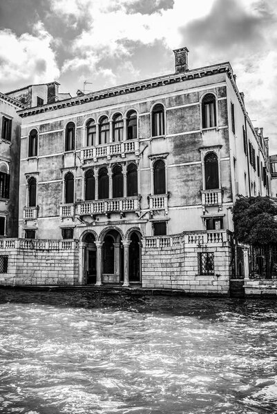 VENICE, ITALY - AUGUST 19, 2016: Famous architectural monuments and facades of old medieval buildings black-white photo. on August 19, 2016 in Venice, Italy.