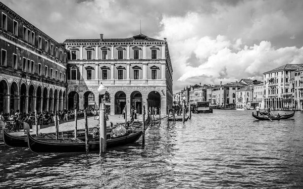 VENICE, ITALY - AUGUST 19, 2016: Traditional gondolas on narrow canal close-up on August 19, 2016 in Venice, Italy.
