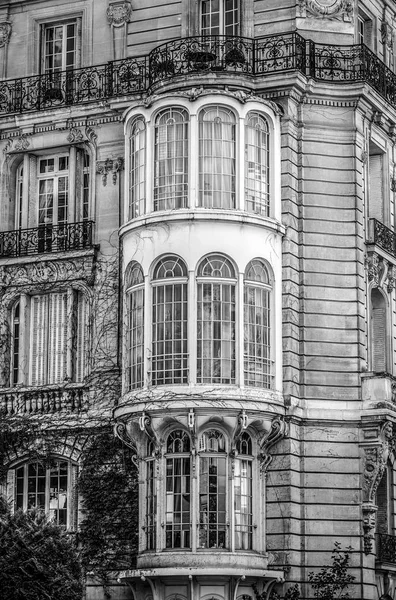 Traditional architecture of residential buildings. Paris - France. Black-white photo.