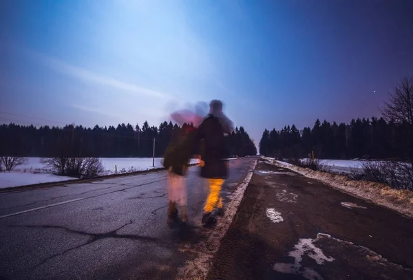 Young couple watching beautiful starry sky on full moon night.