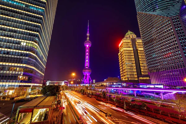 stock image SHANGHAI, CHINA - APRIL 03, 2019: Modern central streets of Shanghai and high-rise buildings at night time.