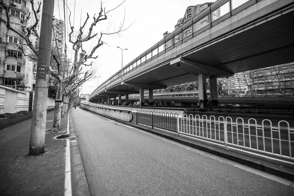 Modern central streets of Shanghai and buildings. Black-white photo.