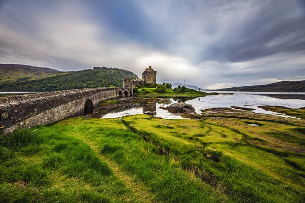 Ancient Scottish castle and beautiful landscape of traditional nature.