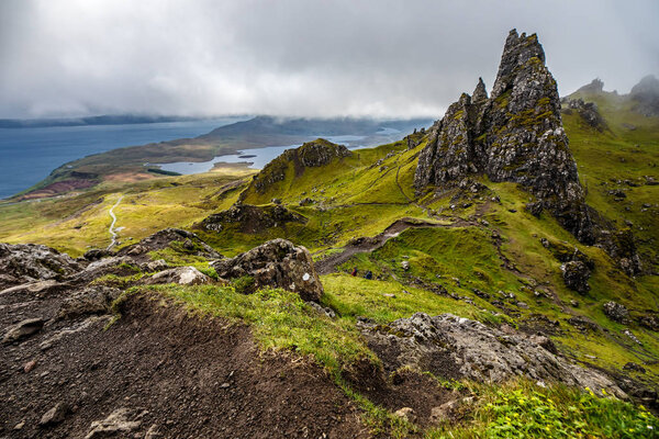Old Man of Storr on the Isle of Skye in Scotland. Mountain landscape with foggy clouds.