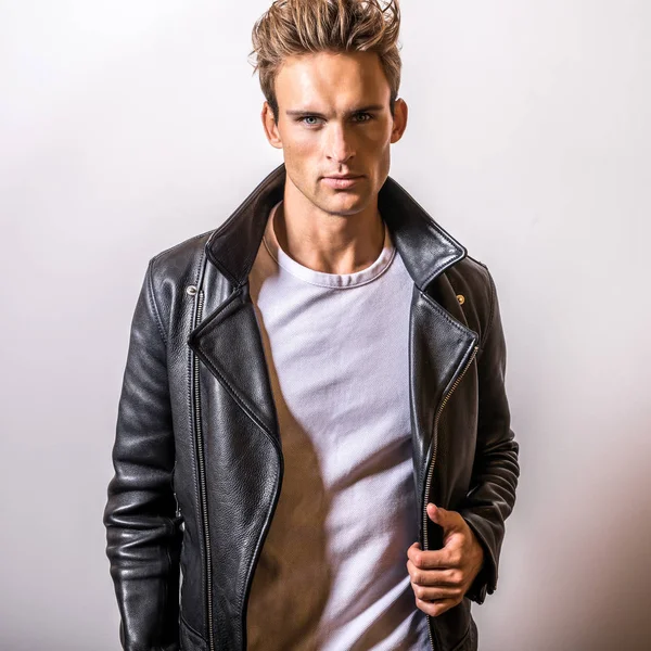 Handsome young man in classic leather jacket.