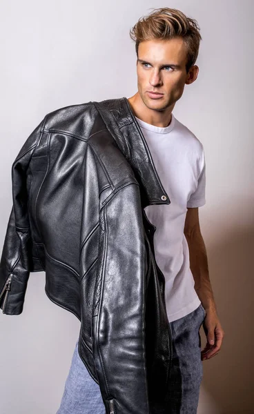 Handsome young man in classic leather jacket.