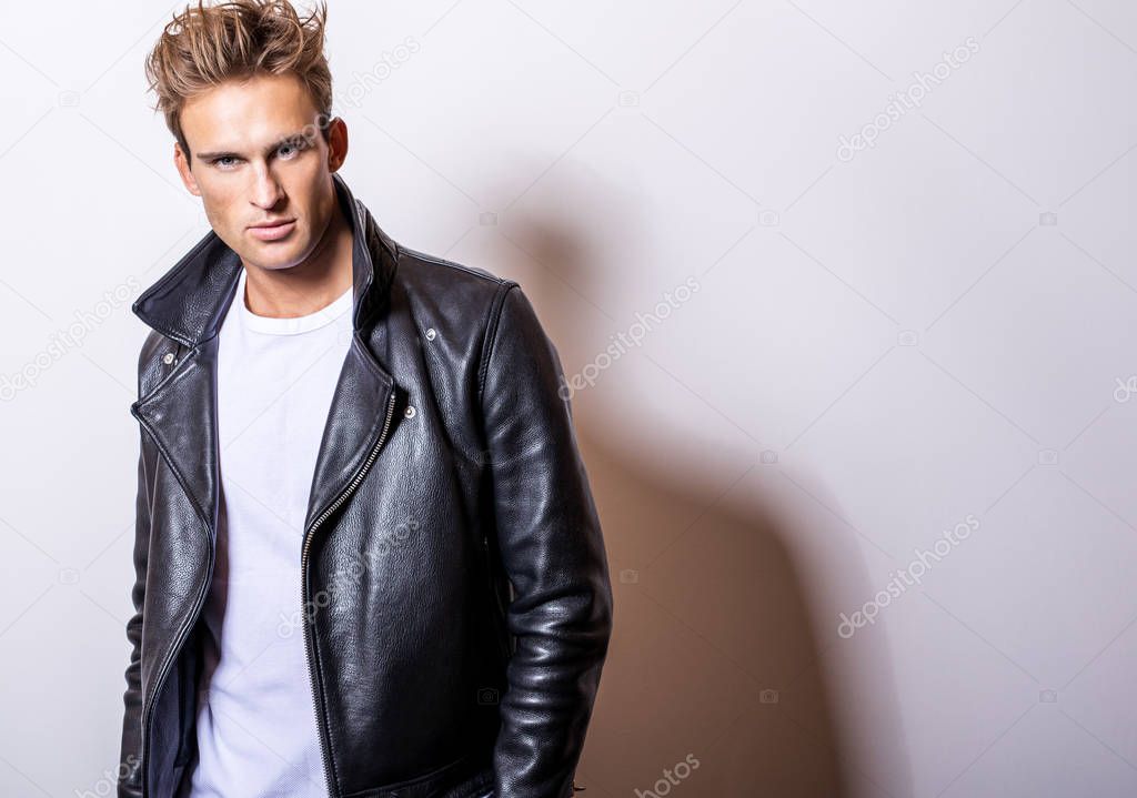 Handsome young man in classic leather jacket.