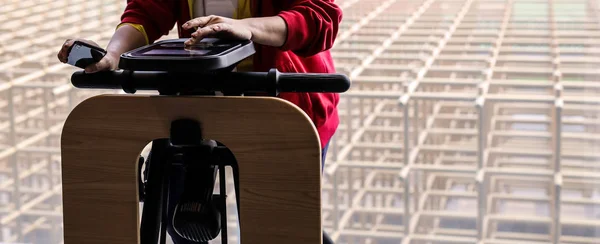 Exercise bike in medical practice. Close-up user hands.