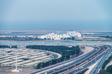 DOHA, QATAR - DECEMBER 3, 2016: Aerial view of city airport. This is a major hub for tourists. clipart