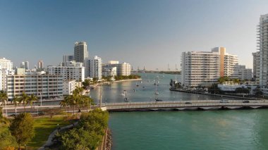 MIAMI BEACH, FL - APRIL 11, 2018: Aerial view of buildings and park. The city is a famous tourist destination in Florida. clipart