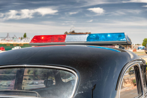 Old police car along Route 66, view of car top.
