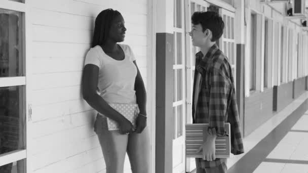 Two Multiracial Teenagers Talking School Hallway — Stock Video