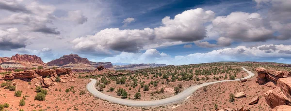 Panoramic aerial view of windy road across the canyon.