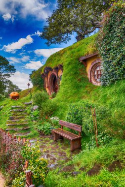 Matamata, New Zealand. Hobbiton, the place where hobbits live in their holes. clipart