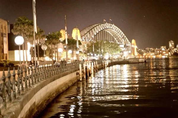 Sydney Harbor Bridge at night from Circular Quay, Australia.
