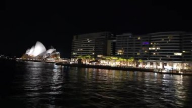 Night view of boats and skyline of Sydney from the ferry