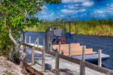 Everglades ariboat ready for exploration tour. clipart