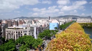 BARCELONA, SPAIN - MAY 2018: Aerial view of Passeig de Gracia with spring vegetation. The city attracts 15 million tourists annually