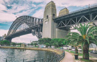 SYDNEY, AUSTRALIA - NOVEMBER 6, 2015: Harbor Bridge as seen from Kirribilli. The city attracts 20 million people annually. clipart