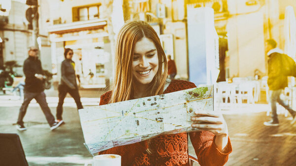 Girl looking to city map.