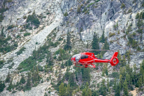 WHISTLER, CANADA - AUGUST 12, 2017: Red rescue helicopter operat — Stock Photo, Image