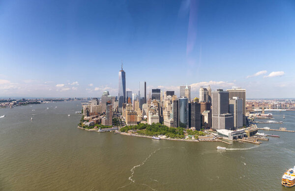 Amazing aerial view of New York City. Lower Manhattan skyline from helicopter on a sunny afternoon.