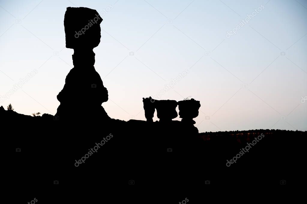 Bryce Canyon National Park hoodoos silhouettes at sunrise with T