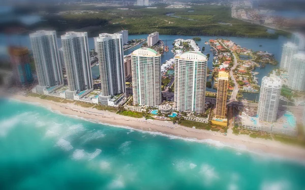 Aerial view of Miami Beach skyscrapers along the sea on a cloudy — Stock Photo, Image