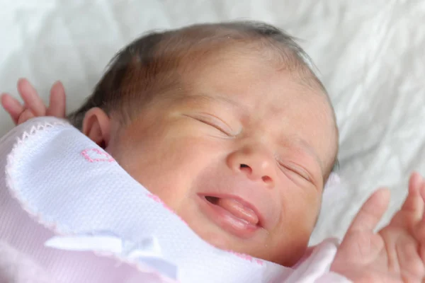 Newborn girl sleeping in the cradle — Stock Photo, Image