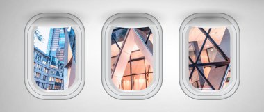 Üç uçak pencereleri ile görülen Londra modern binalar. 