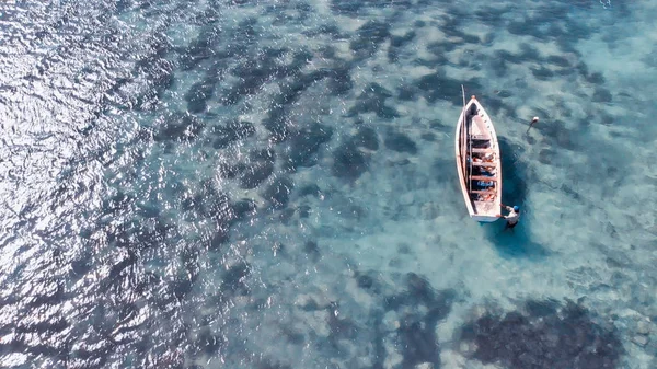 Overhead aerial view of beach and boats