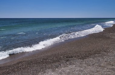 Santorini volkanik Plajı. Arka plan ve tatil konsepti