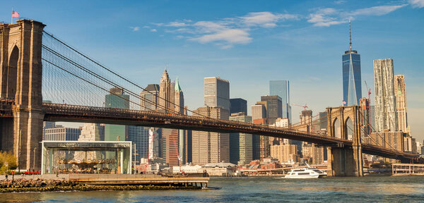 Brooklyn Bridge and Lower Manhattan skyline in autumn.