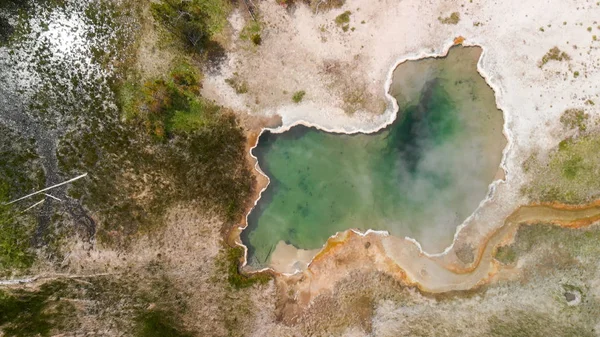Yellowstone Geyser as seen from above. Pool in the middle of the — Stock Photo, Image