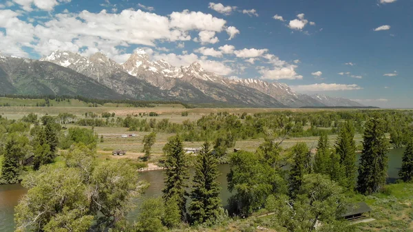 Aerial view of Grand Teton peaks, landscape and Snake River on a — Stock Photo, Image