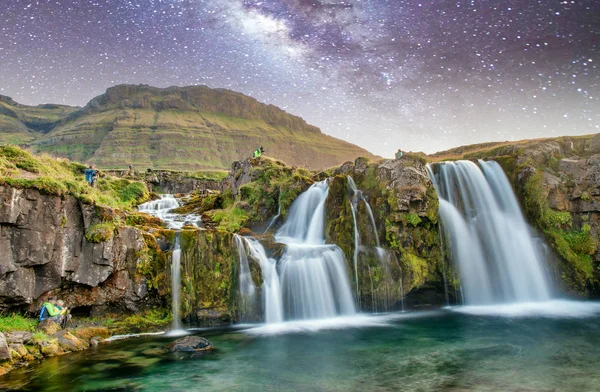 Famous travel location in Iceland. Kirkjufell Waterfalls at nigh