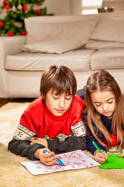 Young brother and sister at home for Christmas. Happy family in — Stock Photo, Image